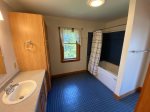 Full bathroom with shower and jetted tub on second floor